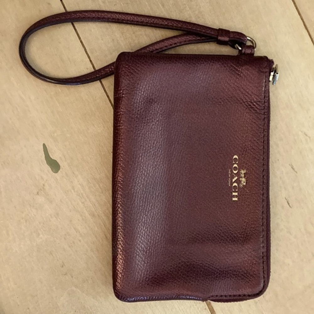 Coach of New York purple‎ wristlet.